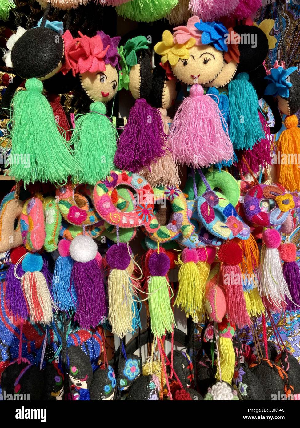 Mexican marketplace in Cabo. Lots of pompoms and yarn accessories. So colorful! Stock Photo