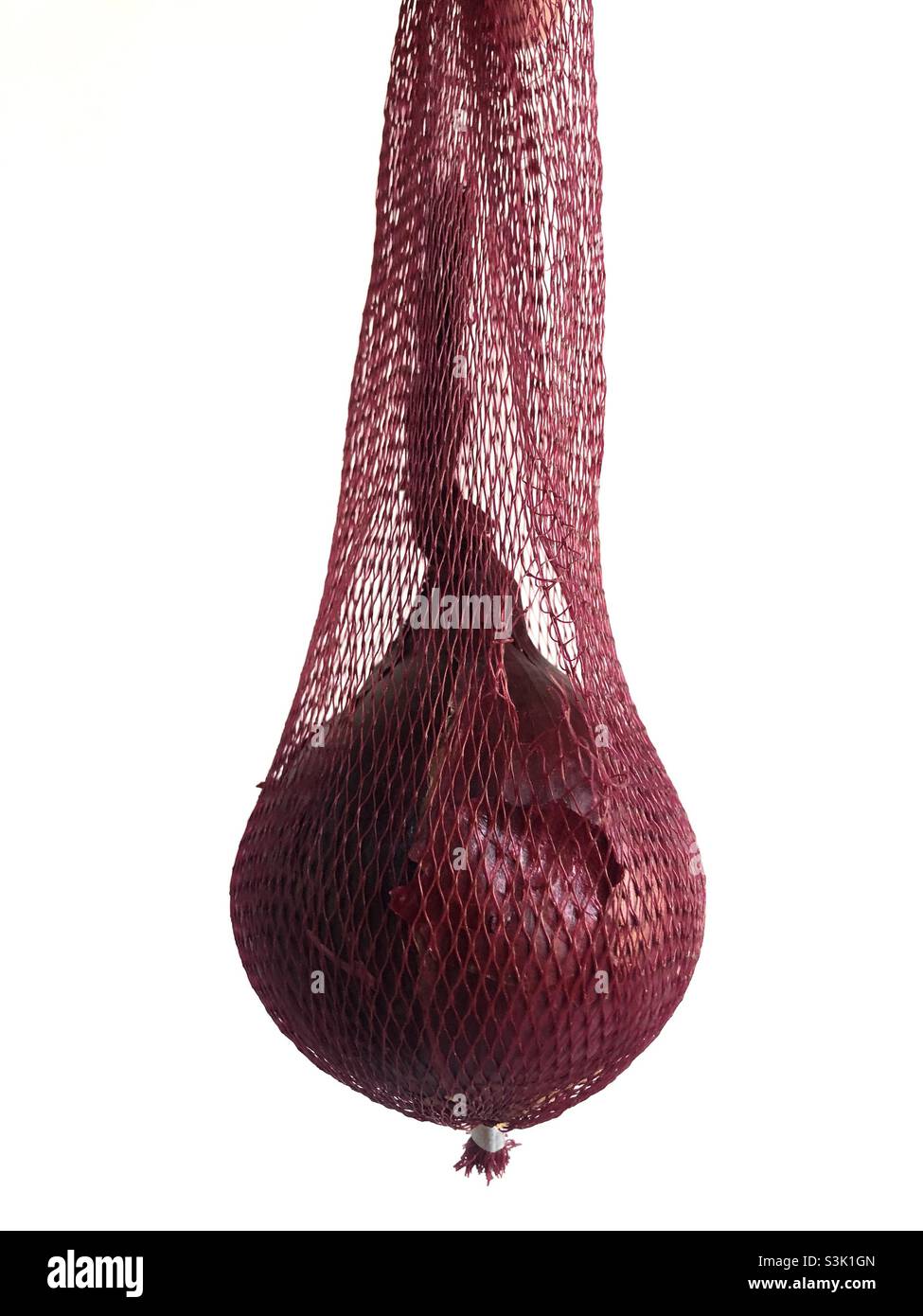 Red onion in a purple net - Smartphone Captured Stock Image