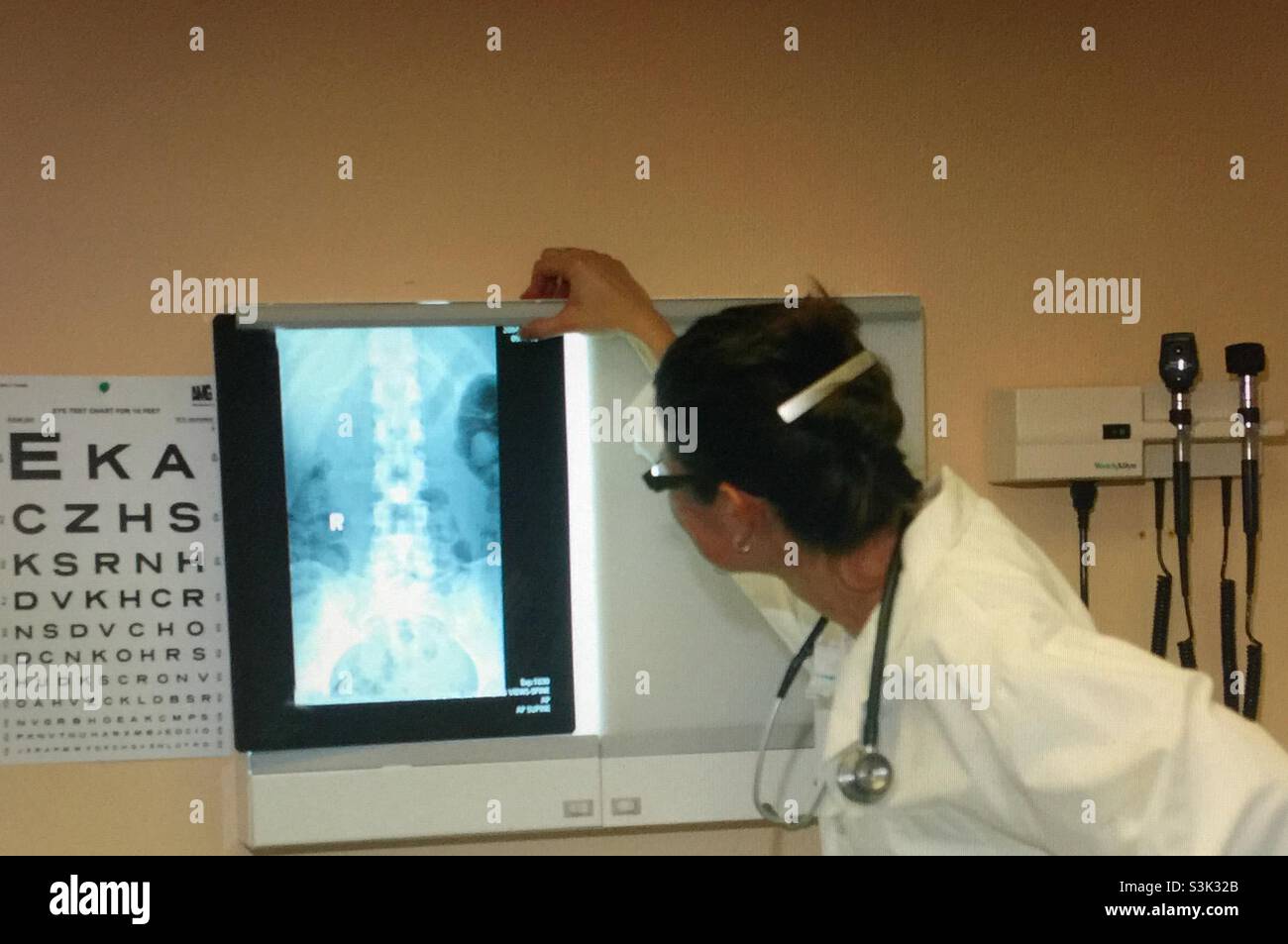 Doctor inspecting an x ray - Smartphone Captured Stock Image