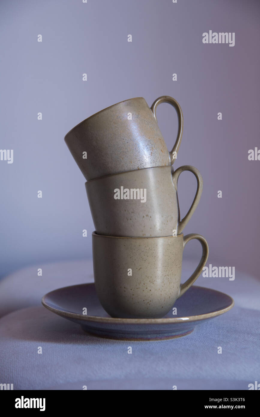 Three coffee cups on a plate on top of each other - Smartphone Captured Stock Image