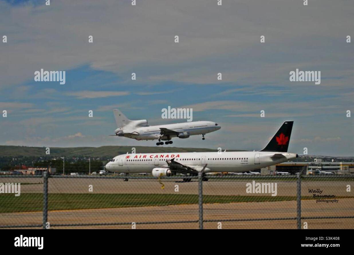 Two jet liners, piggy back, lift off - Smartphone Captured Stock Image