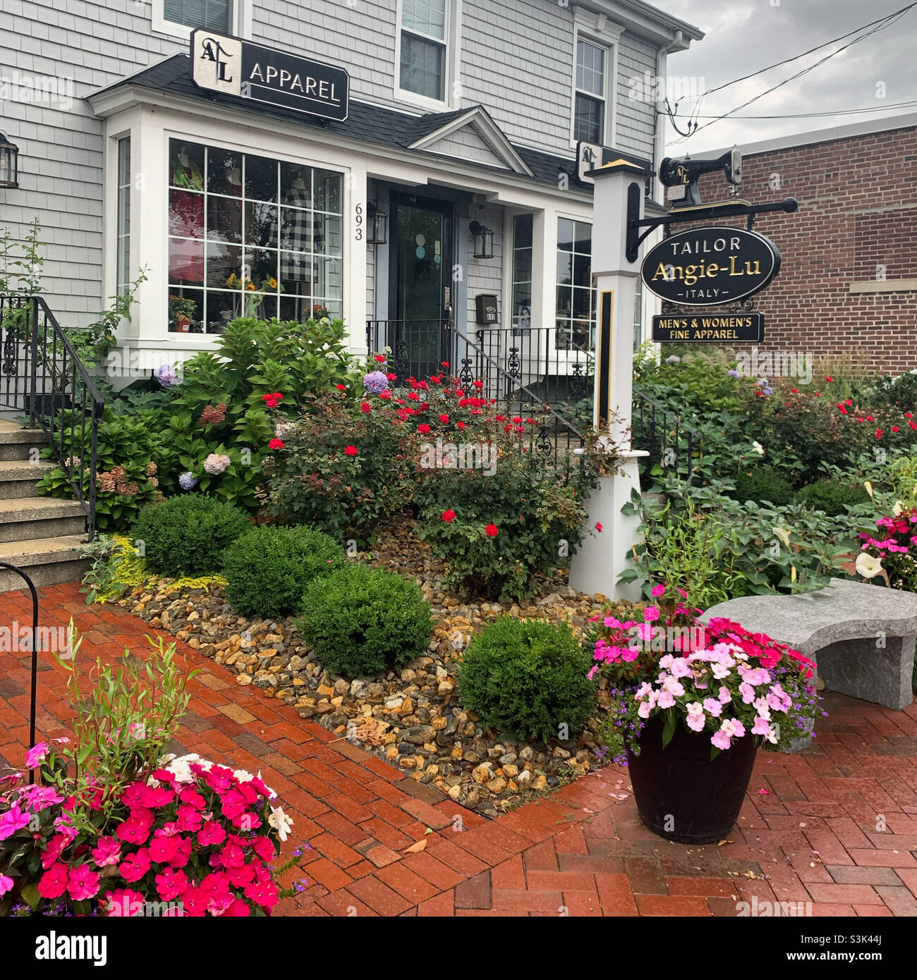 Flowers in front of a tailor’s shop in Madison, New Haven County, Connecticut, United States - Smartphone Captured Stock Image