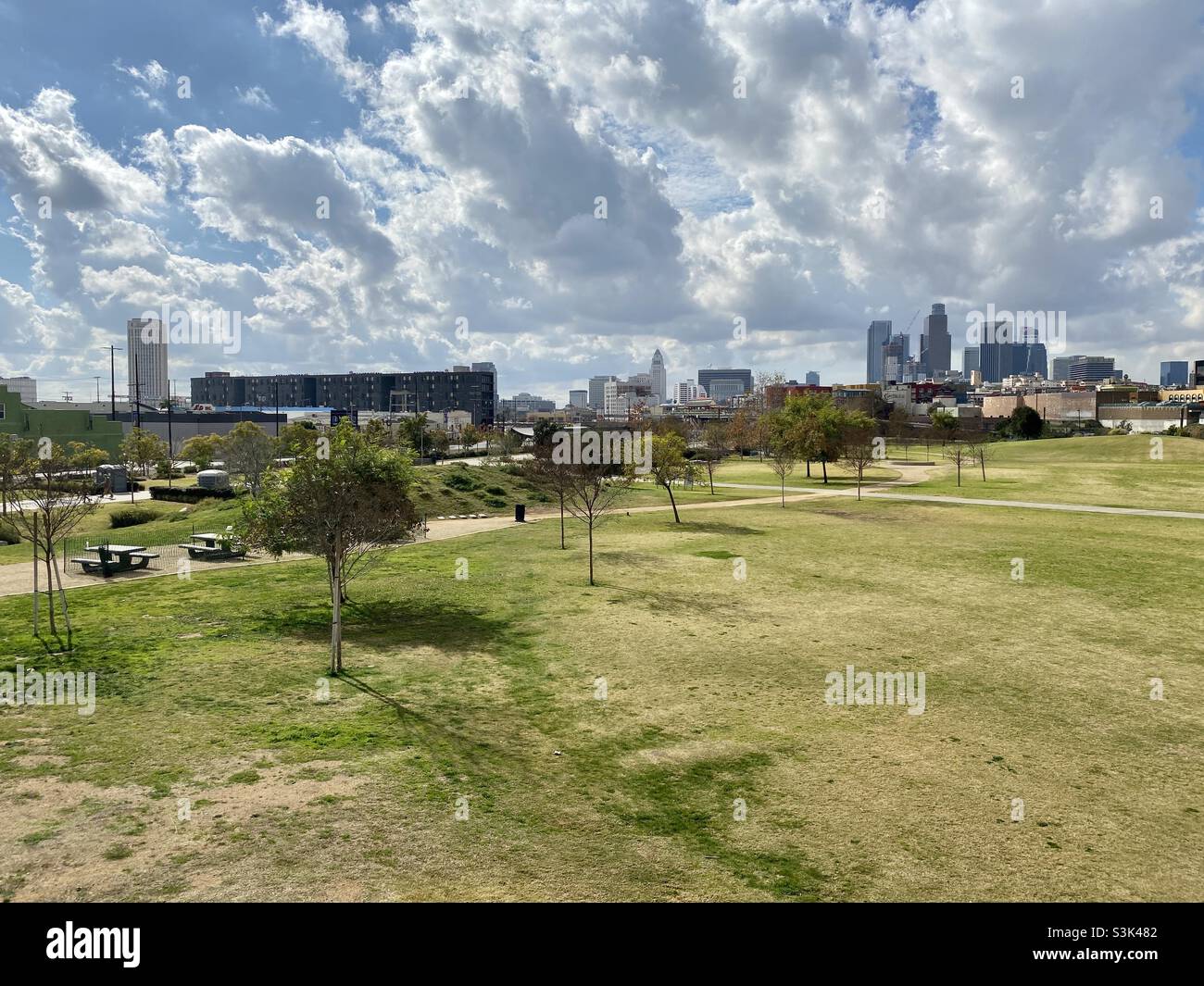 Downtown skyline in the distance, seen from Los Angeles State Historic Park to the north of the city on overcast day - Smartphone Captured Stock Image