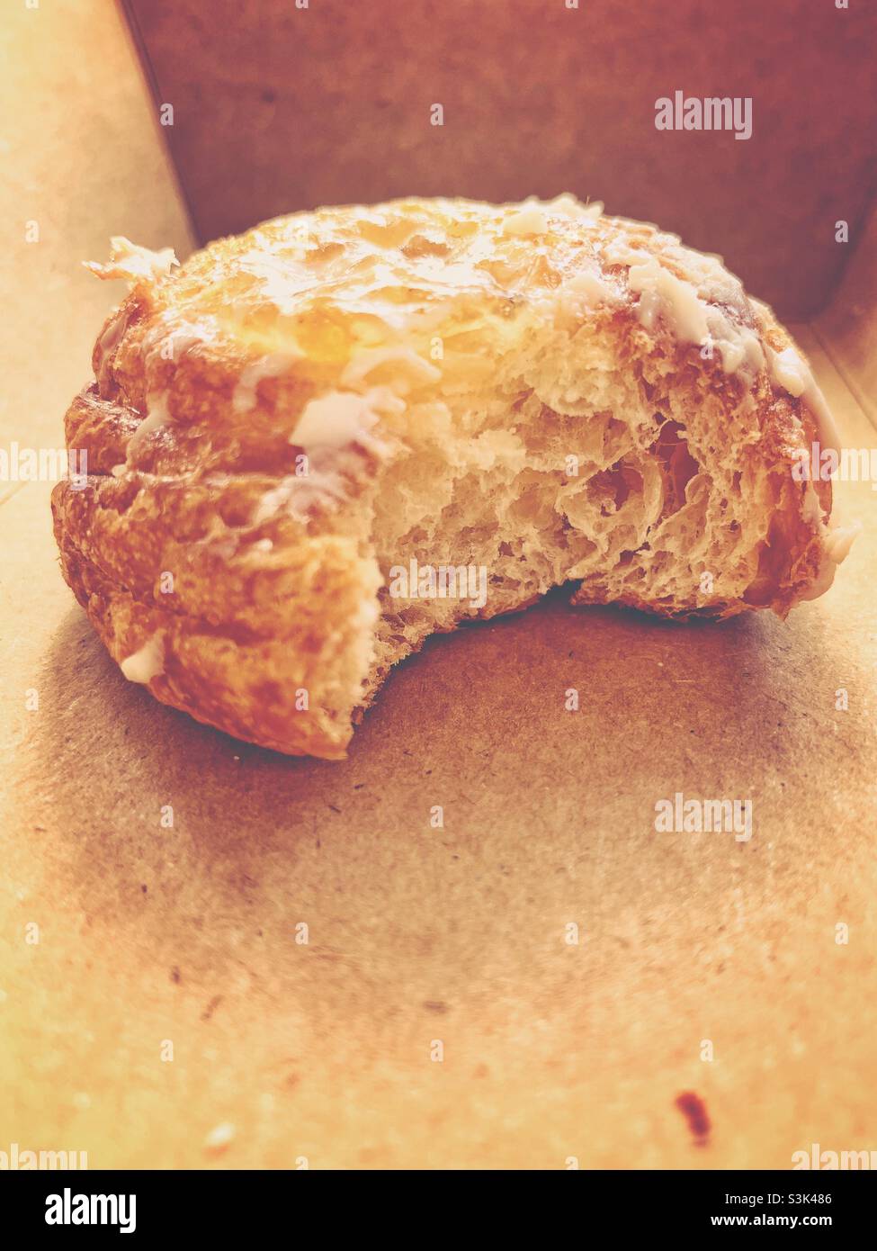 A big bite of one piece danish bread. Close up shot. - Smartphone Captured Stock Image