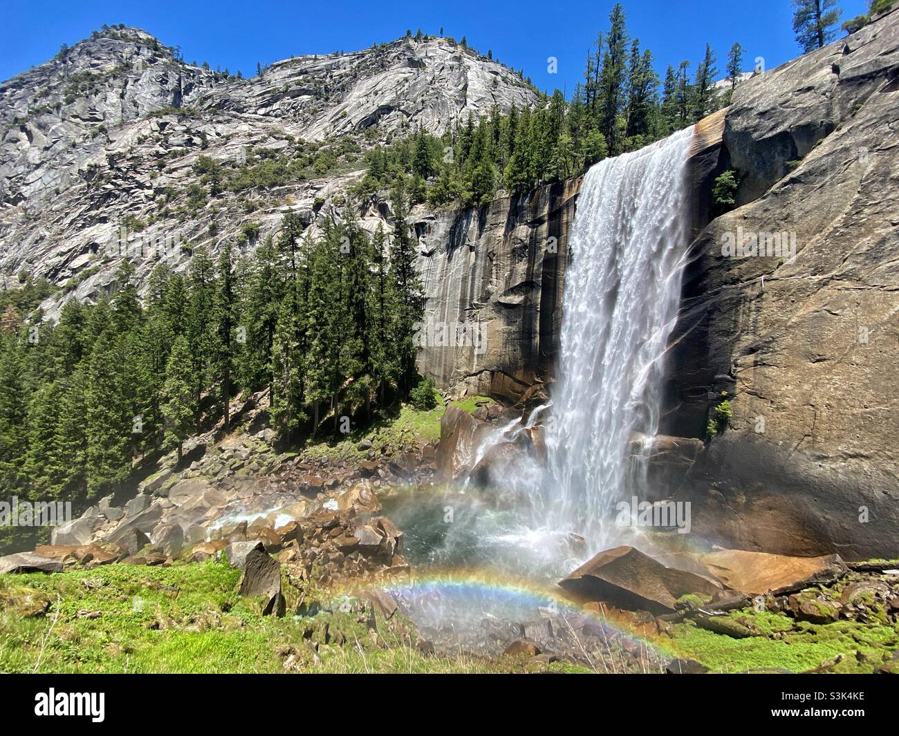 Vernal Falls waterfall in daytime on a sunny day in June with a rainbow in Yosemite National Park, California, USA - Smartphone Captured Stock Image