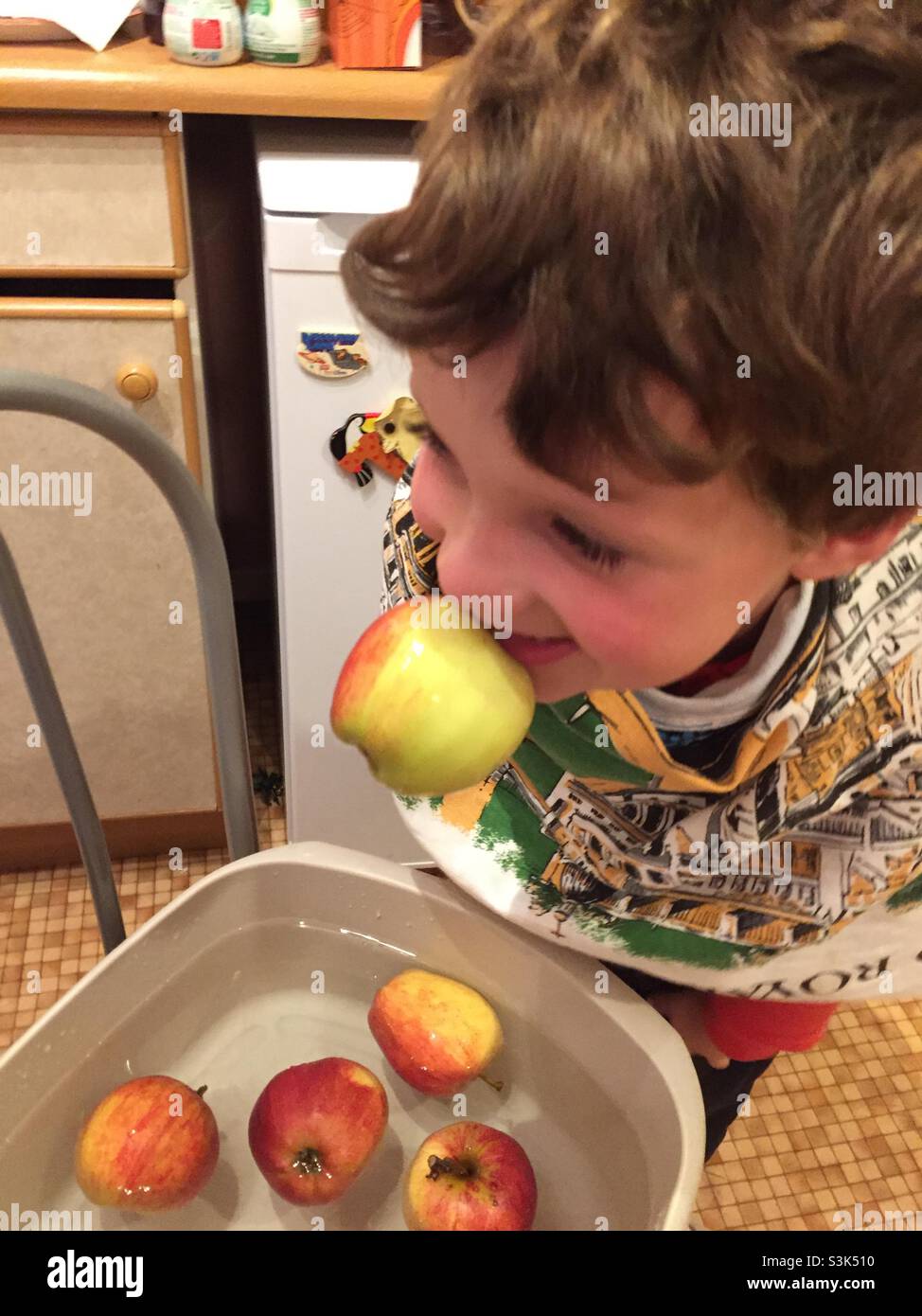 A child apple bobbing Stock Photo