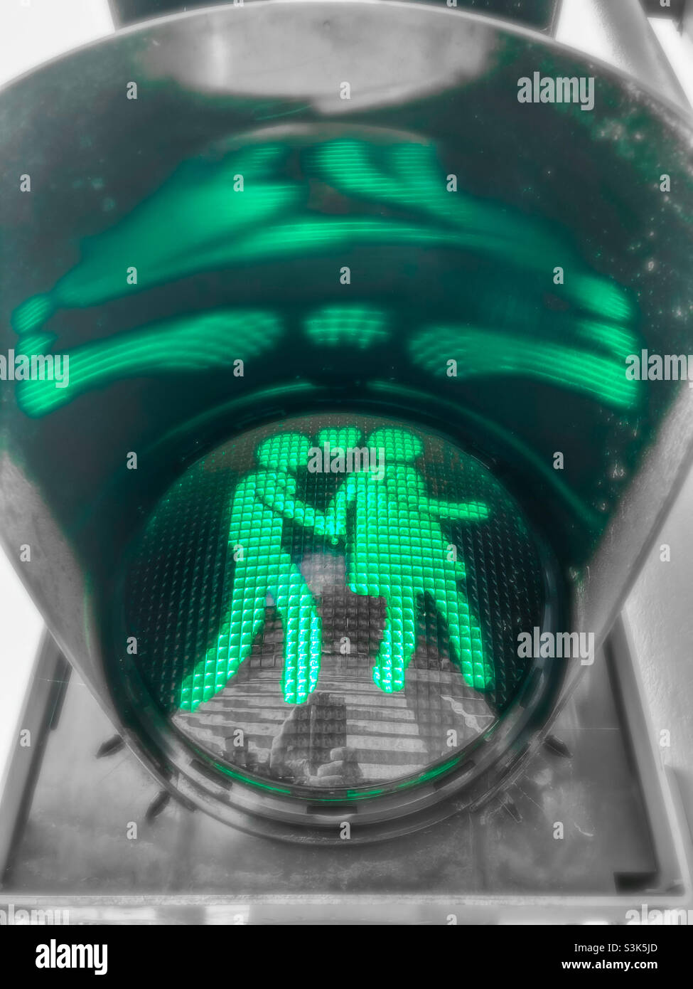 Green pedestrian traffic light in Villach, Austria Stock Photo