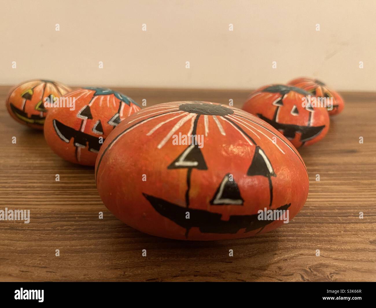 Halloween time with stone painted pumpkins Stock Photo