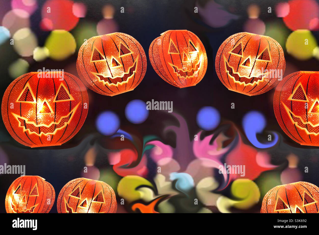 Spooky Halloween pumpkin lights on against bright and colourful background Stock Photo