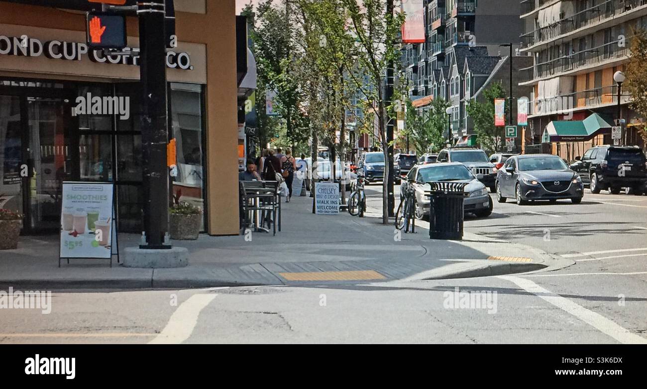 Street photography, Kensington, Calgary, Alberta ,pedestrian , scooter