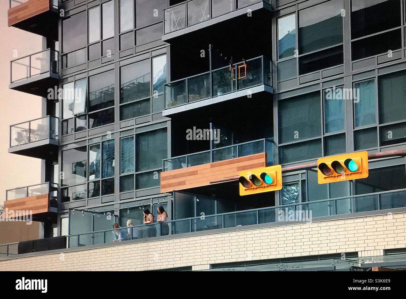 Street photography, Kensington, Calgary, Alberta , 10 street, guitar, apartment, condo, high rise, parallel, converging, squares - Smartphone Captured Stock Image