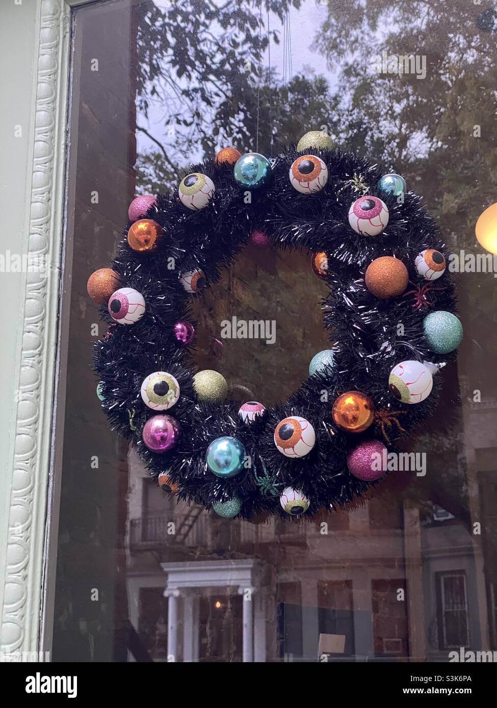 Spooky Halloween wreath on front door - Smartphone Captured Stock Image