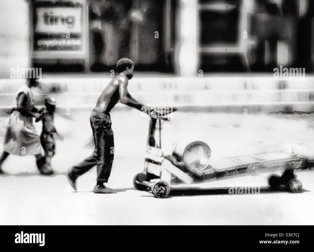 Boy and trolley in rural Jamaica. - Smartphone Captured Stock Image