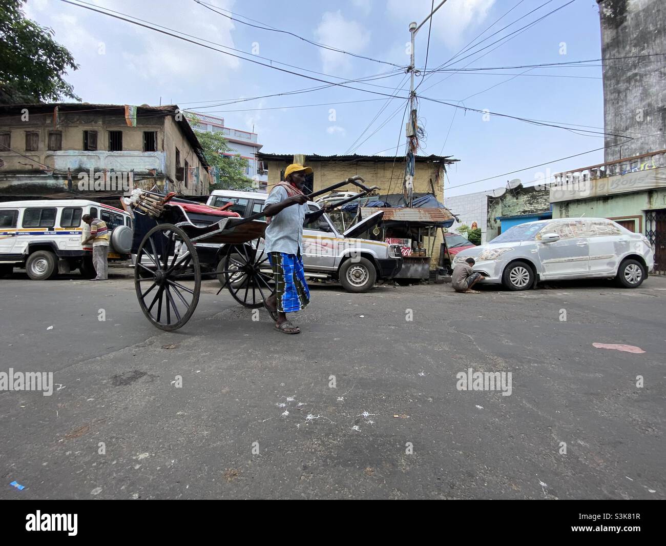 A manually pulled rickshaw in the street of Kolkata - Smartphone Captured Stock Image