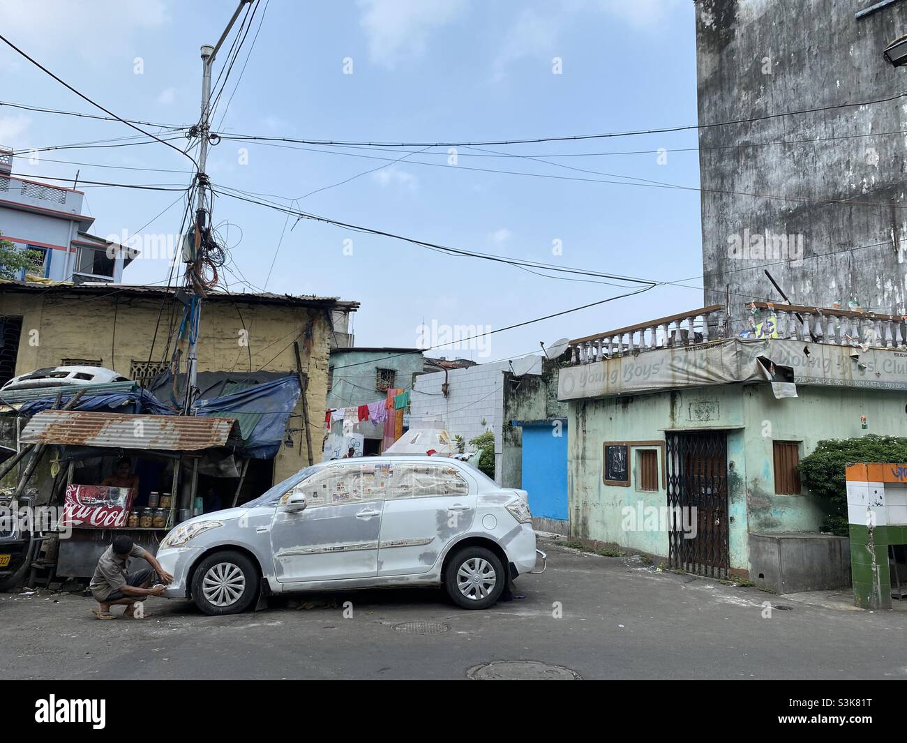 A man preparing a car for painting work - Smartphone Captured Stock Image