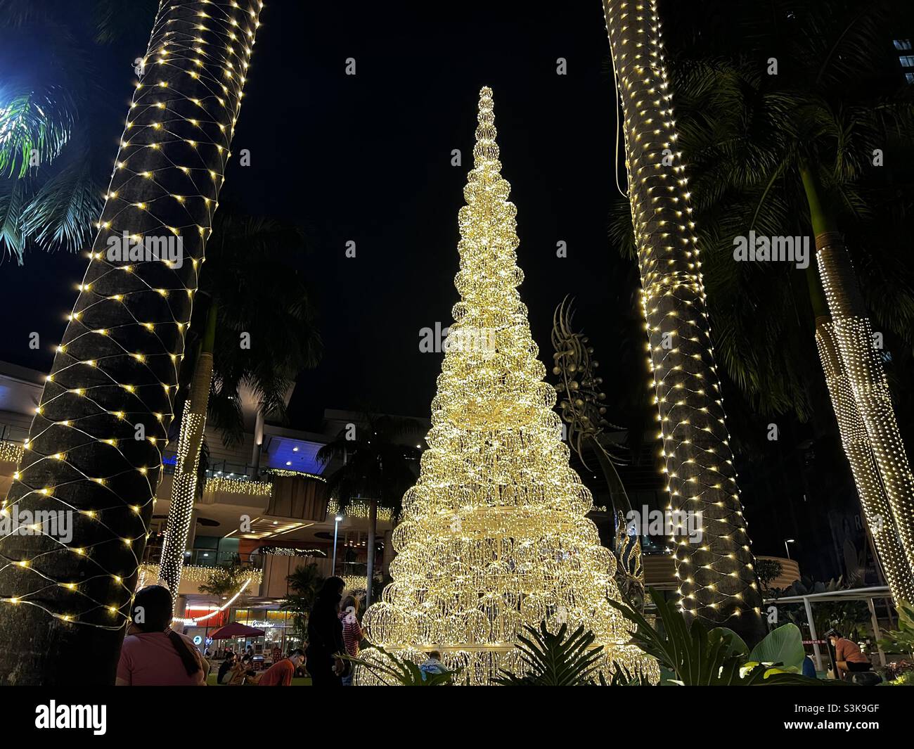Elegant Christmas tree adorned with ball of lights. Philippines has the longest Christmas celebration in the world. Stock Photo