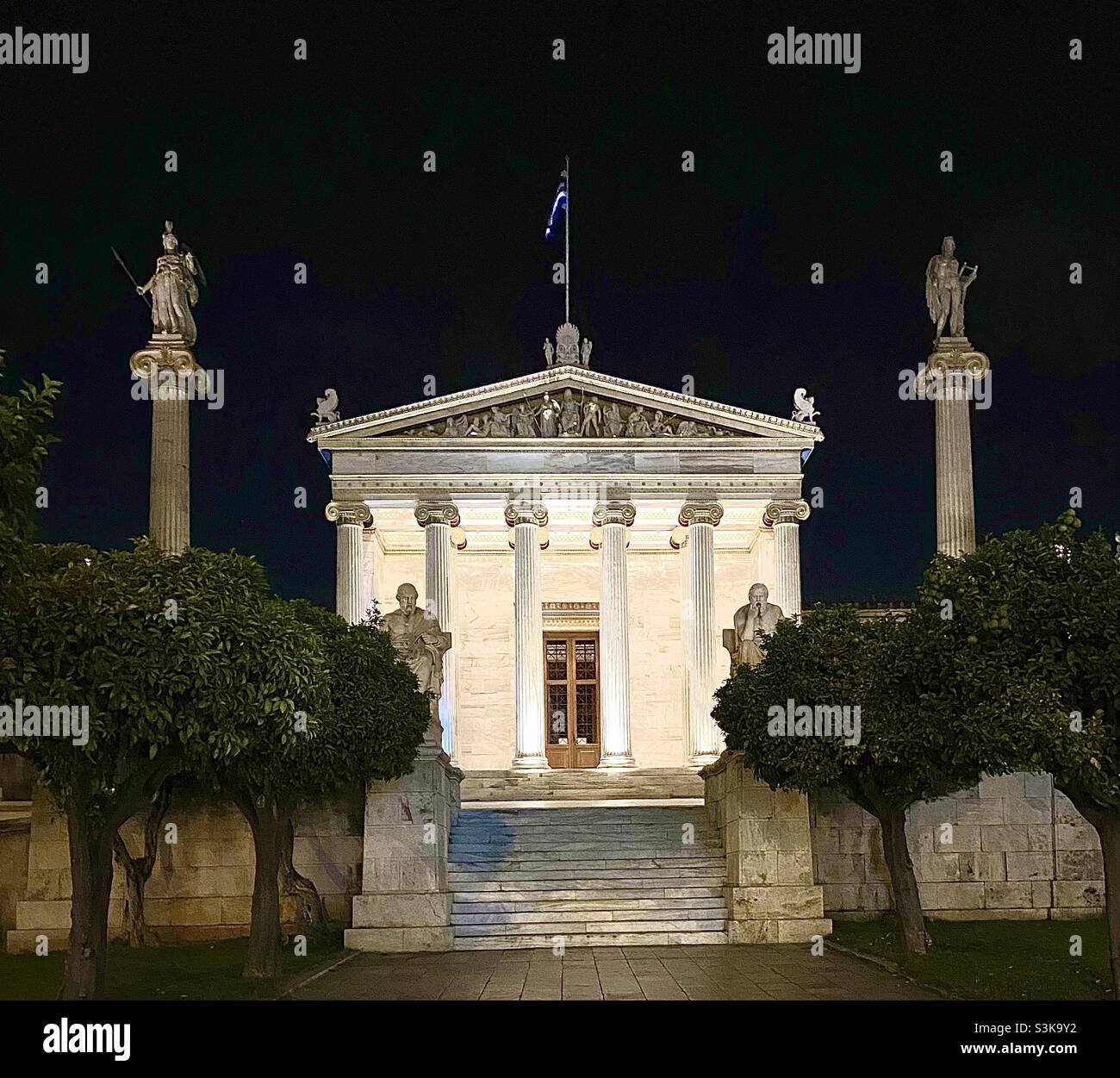 The Academy of Athens, Greece, late at night, the oldest and highest research institution in Greece. The building is part of an architectural trilogy alongside the National Library and the University. Stock Photo