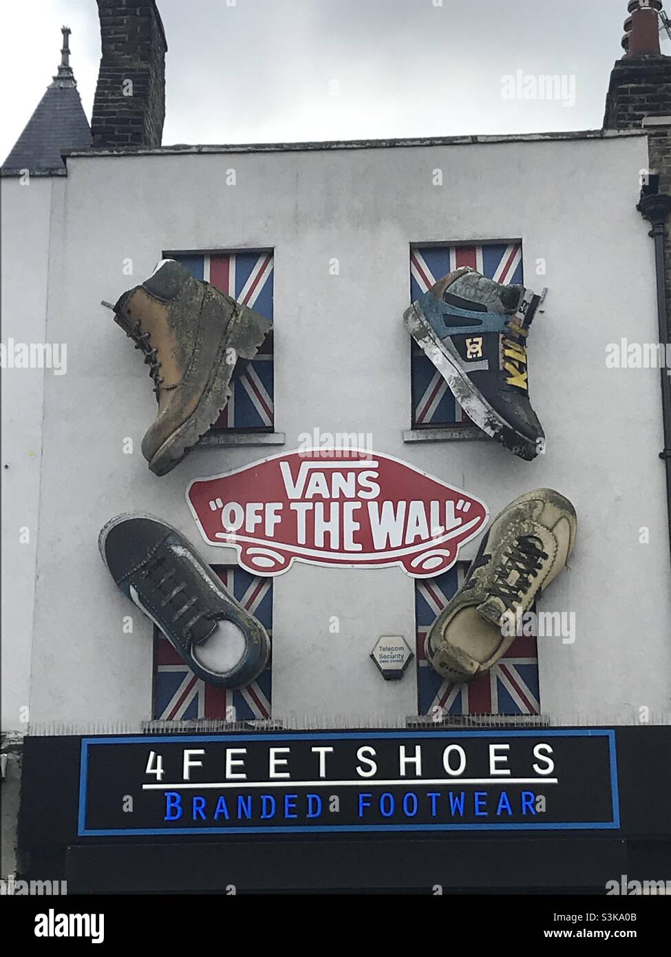 Camden Town, with Shoe sculptures attached to a branded footwear shop Stock  Photo - Alamy