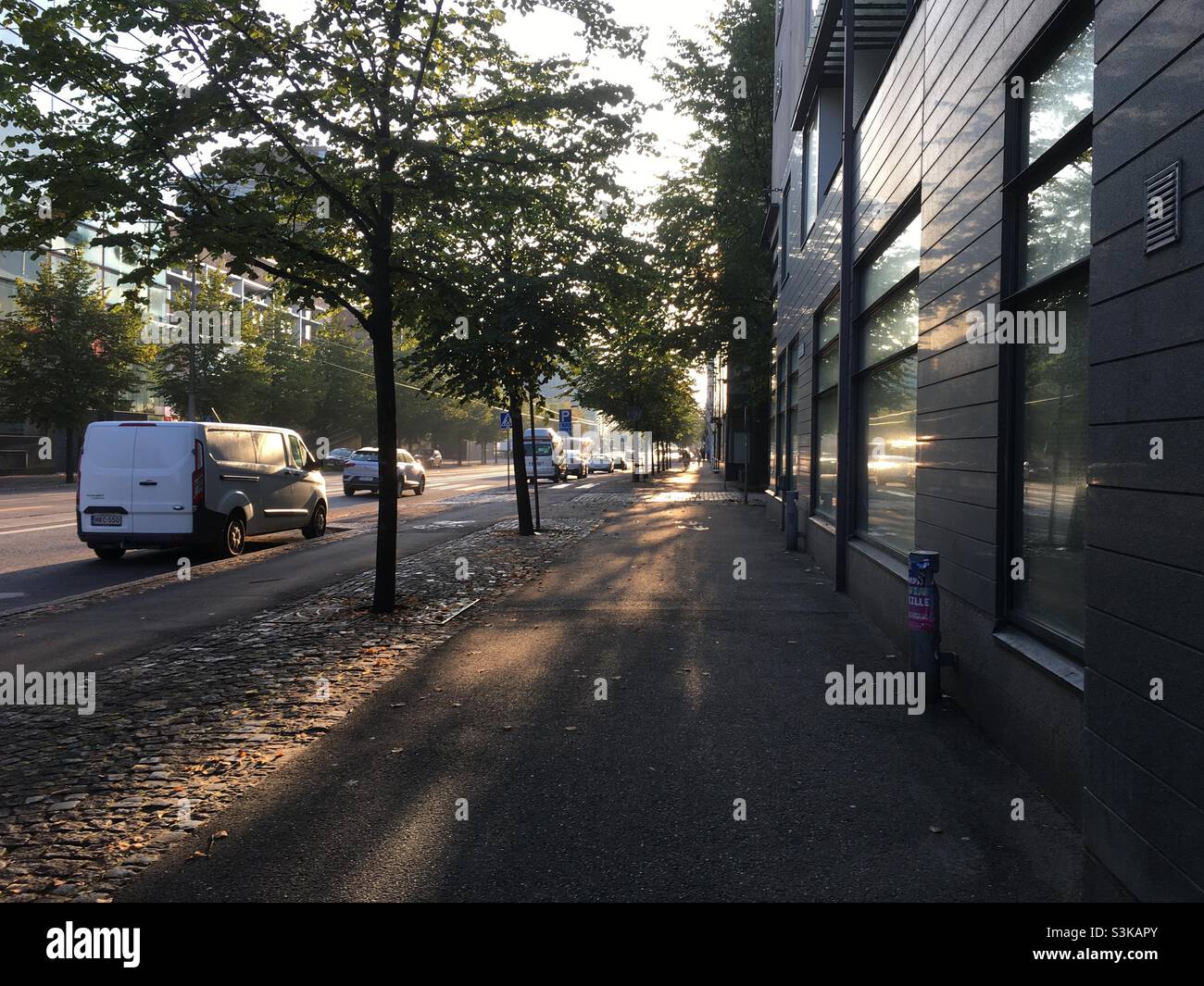 Sunny autumn morning view of empty city street. Ruoholahti, Helsinki. - Smartphone Captured Stock Image