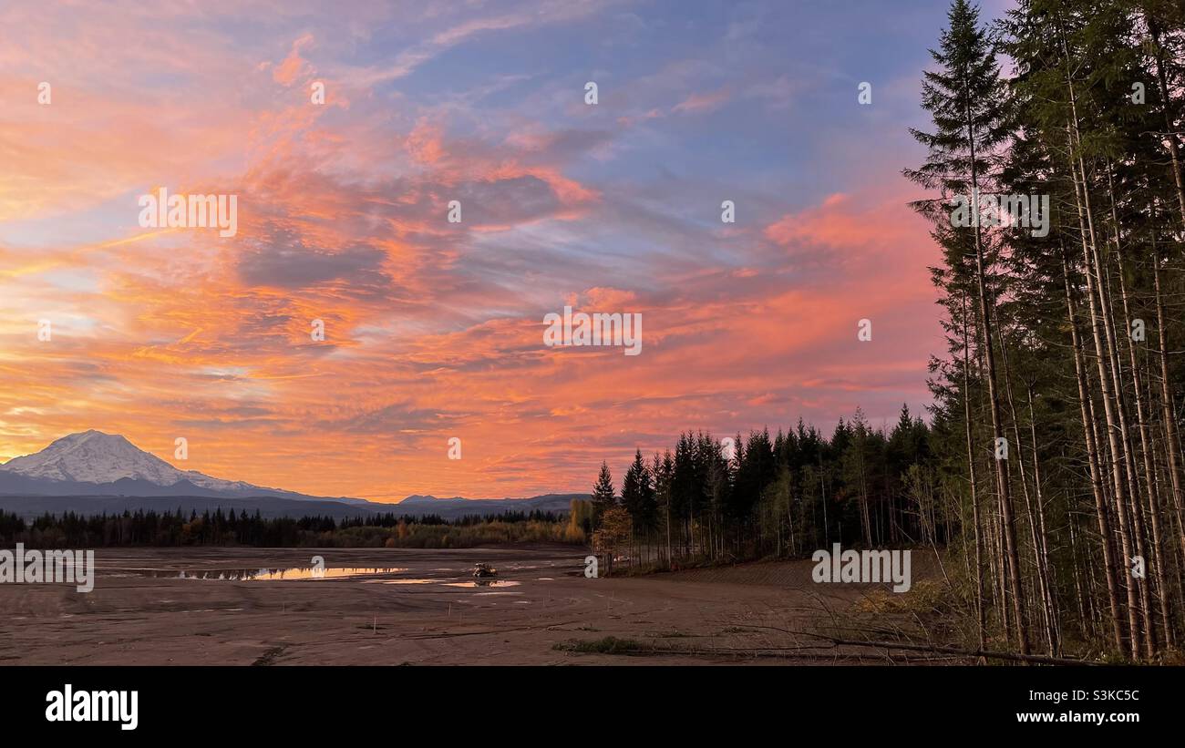 The sun rising over a desecrated landscape. Stock Photo