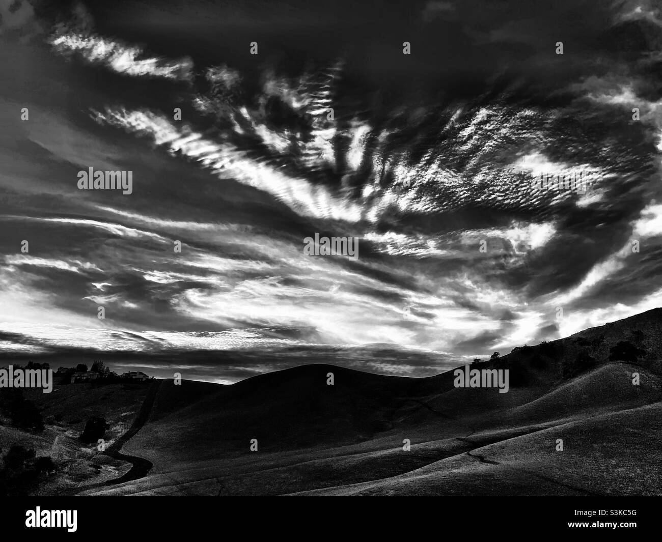 California foothill with clouds overhead, in black snd white Stock Photo