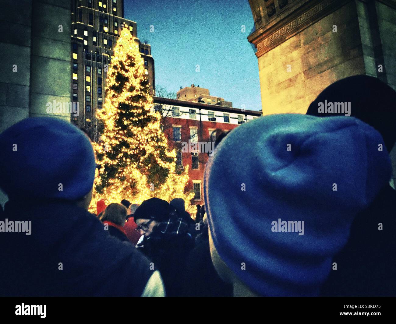 People attending the tree lighting ceremony at Washington Square Park