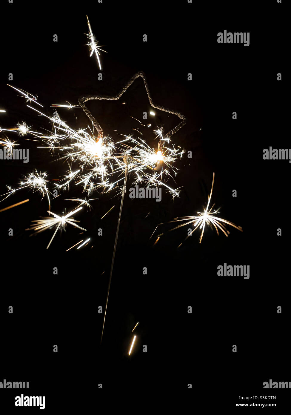 Star shaped sparkler - Smartphone Captured Stock Image