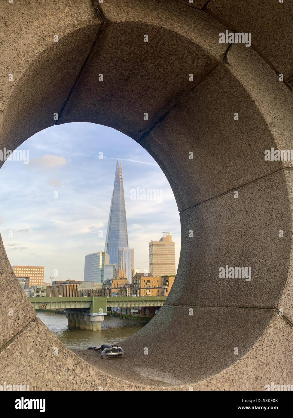 View of the shard through a circular opening - Smartphone Captured Stock Image