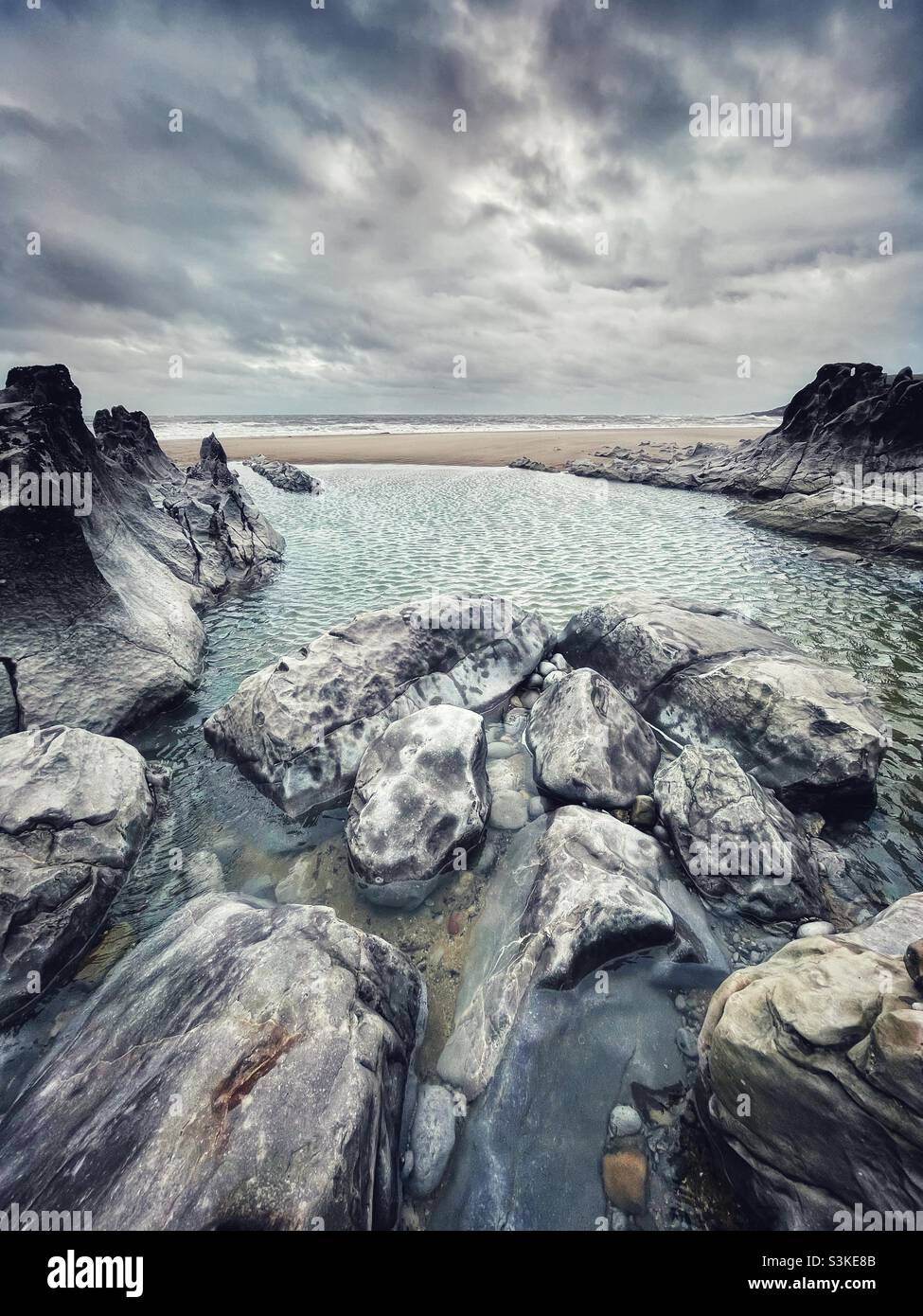 Rocky pool on Mewslade beach, Gower, South West Wales, November. - Smartphone Captured Stock Image
