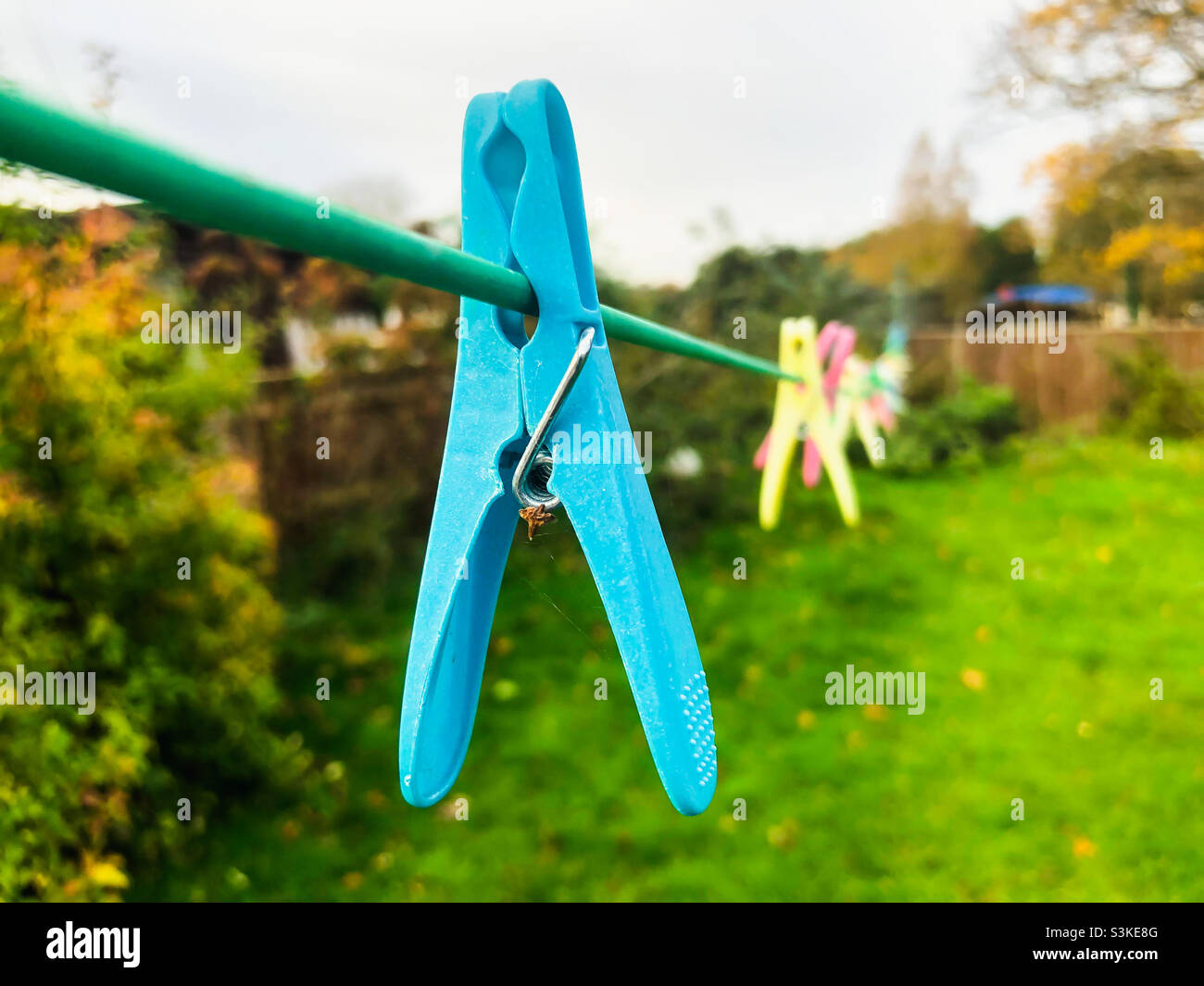 Clothes legs on a washing line in autumn. - Smartphone Captured Stock Image