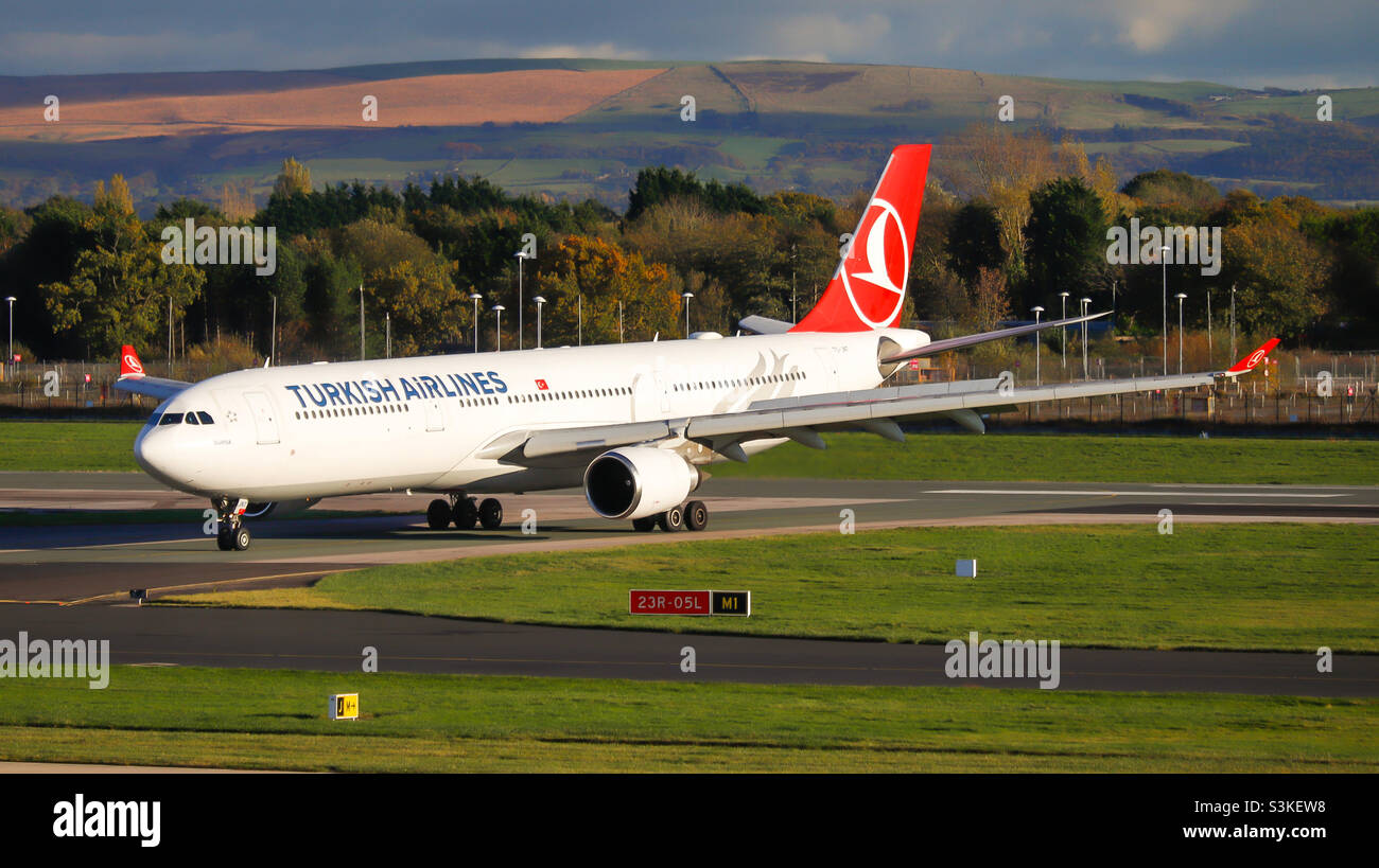 Turkish Airlines Airbus A330-300 (TC-JNT) vacating runway 05L after landing at Manchester Airport on 4/11/21. Stock Photo