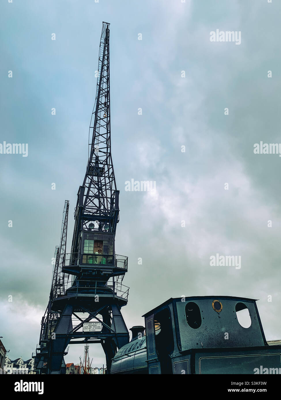 Rear view of a steam train and cargo crane at Bristol harbour - Smartphone Captured Stock Image