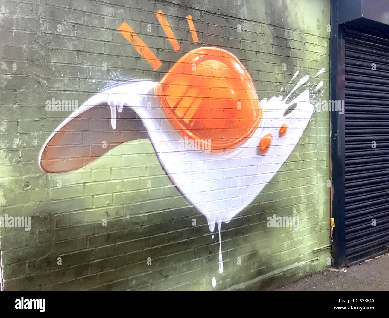 Sunny Side Up A Delicious Fried Egg Painting On A Brick Wall Next To A Lock Up Cafe London Stock Photo Alamy