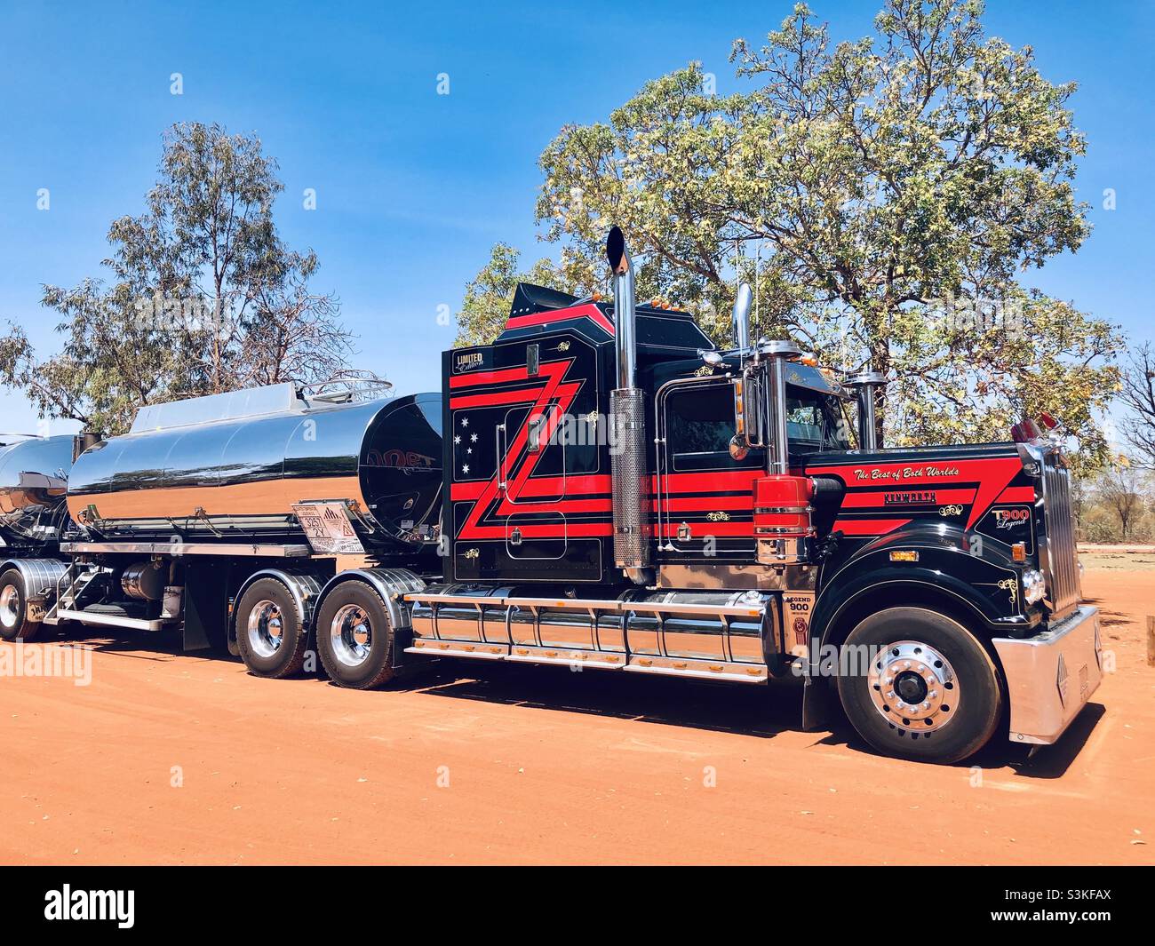 A road train with shiny trailer is parked at an outback service station - Smartphone Captured Stock Image