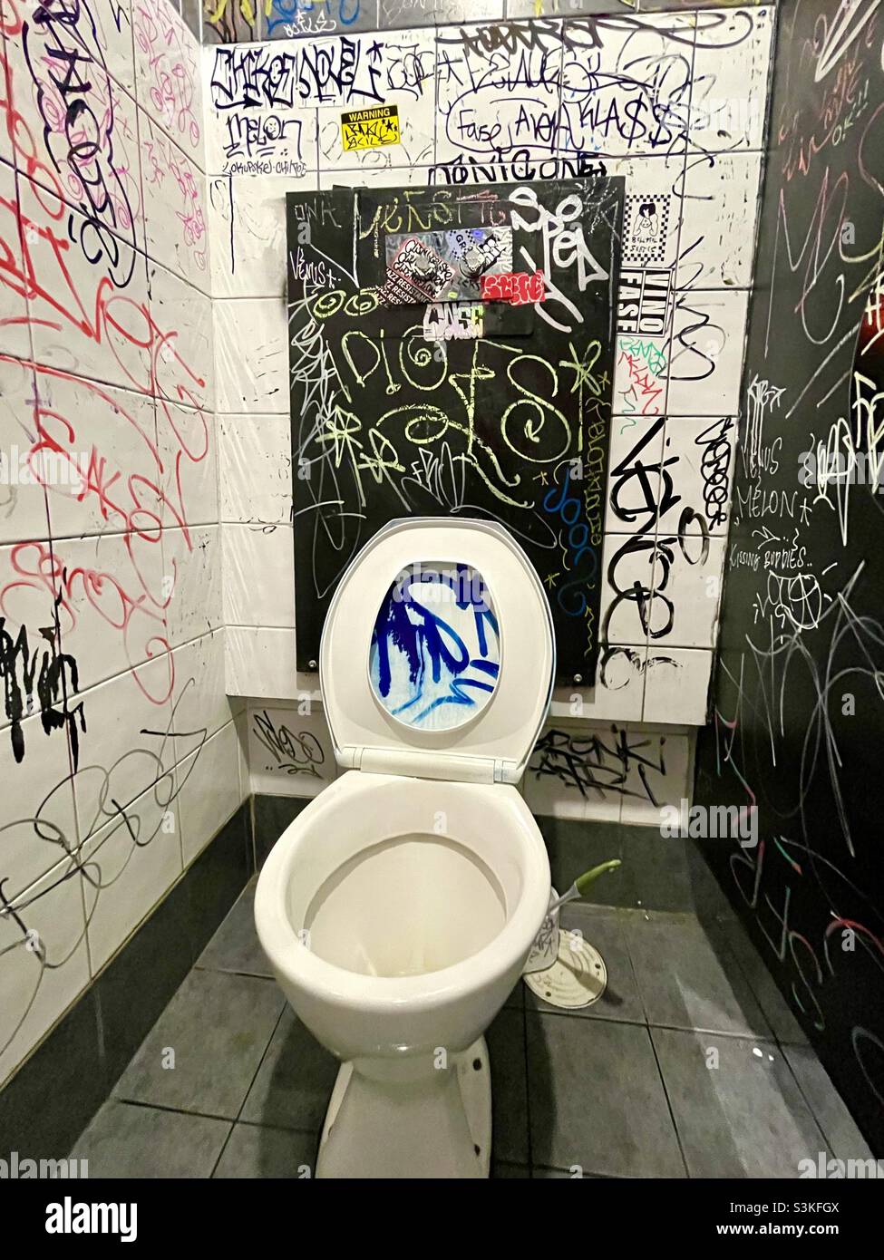 Graffiti and tags in a public toilet walls Stock Photo Alamy