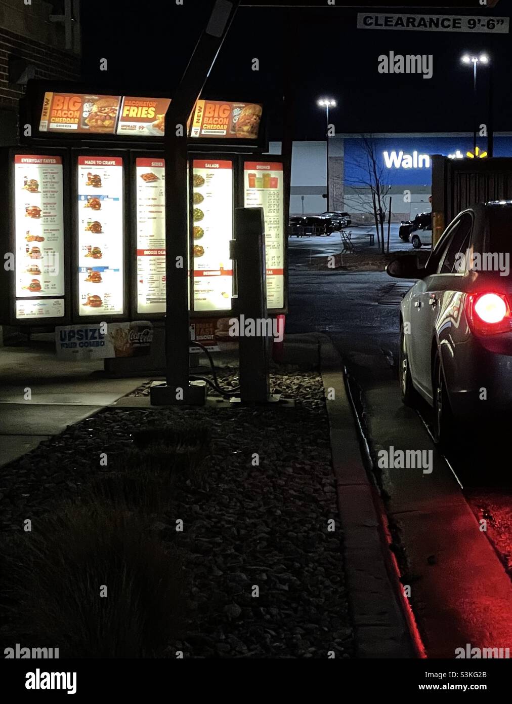 At a fast food drive thru after dark. - Smartphone Captured Stock Image