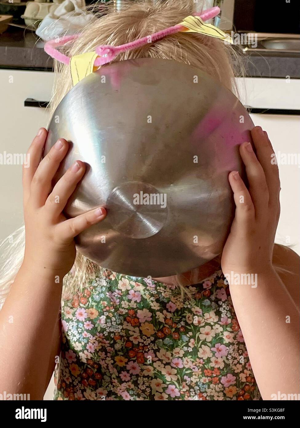 A child licking the bowl - Smartphone Captured Stock Image