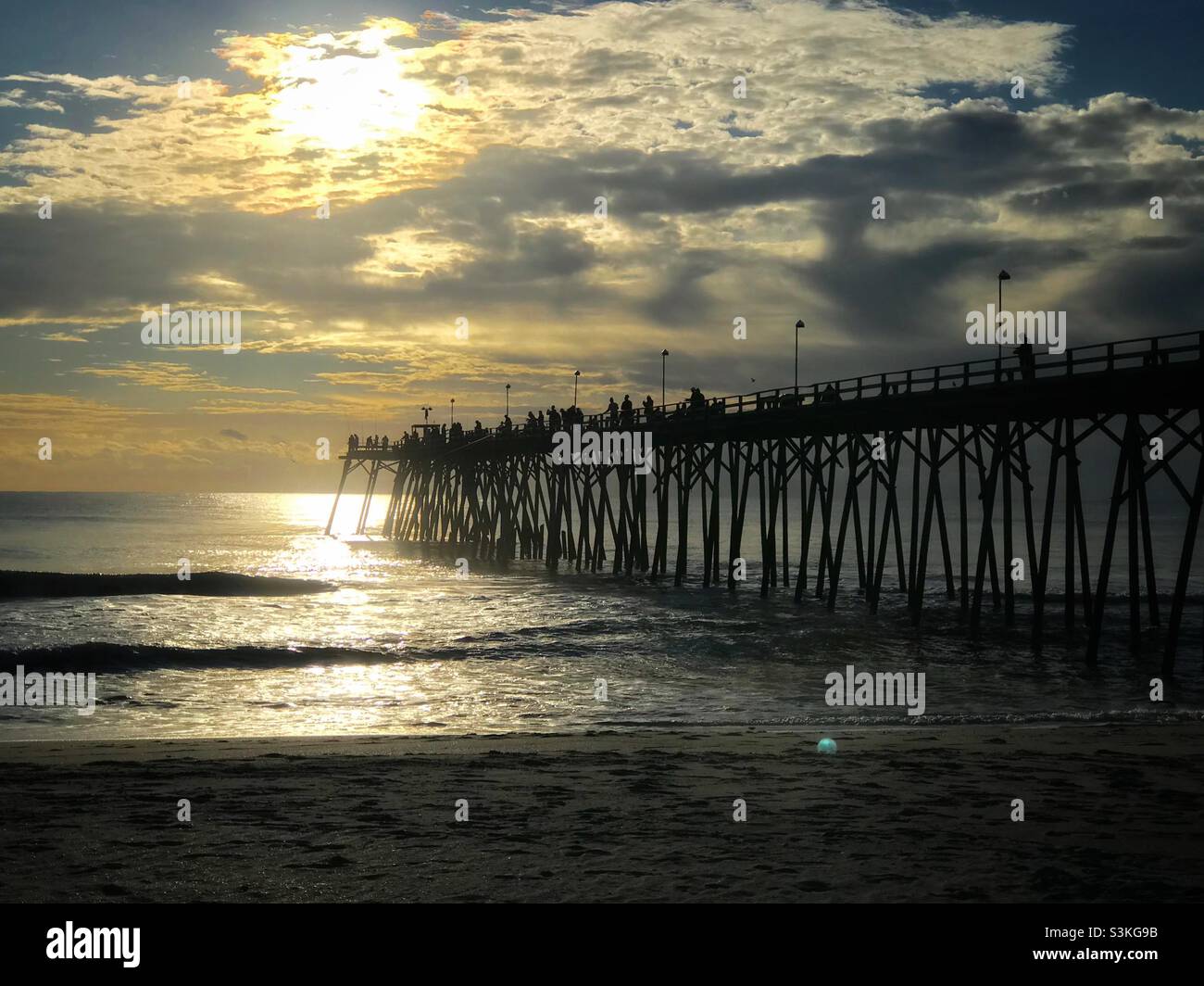 Early morning photo of pier at Kure Beach, North Carolina - Smartphone Captured Stock Image