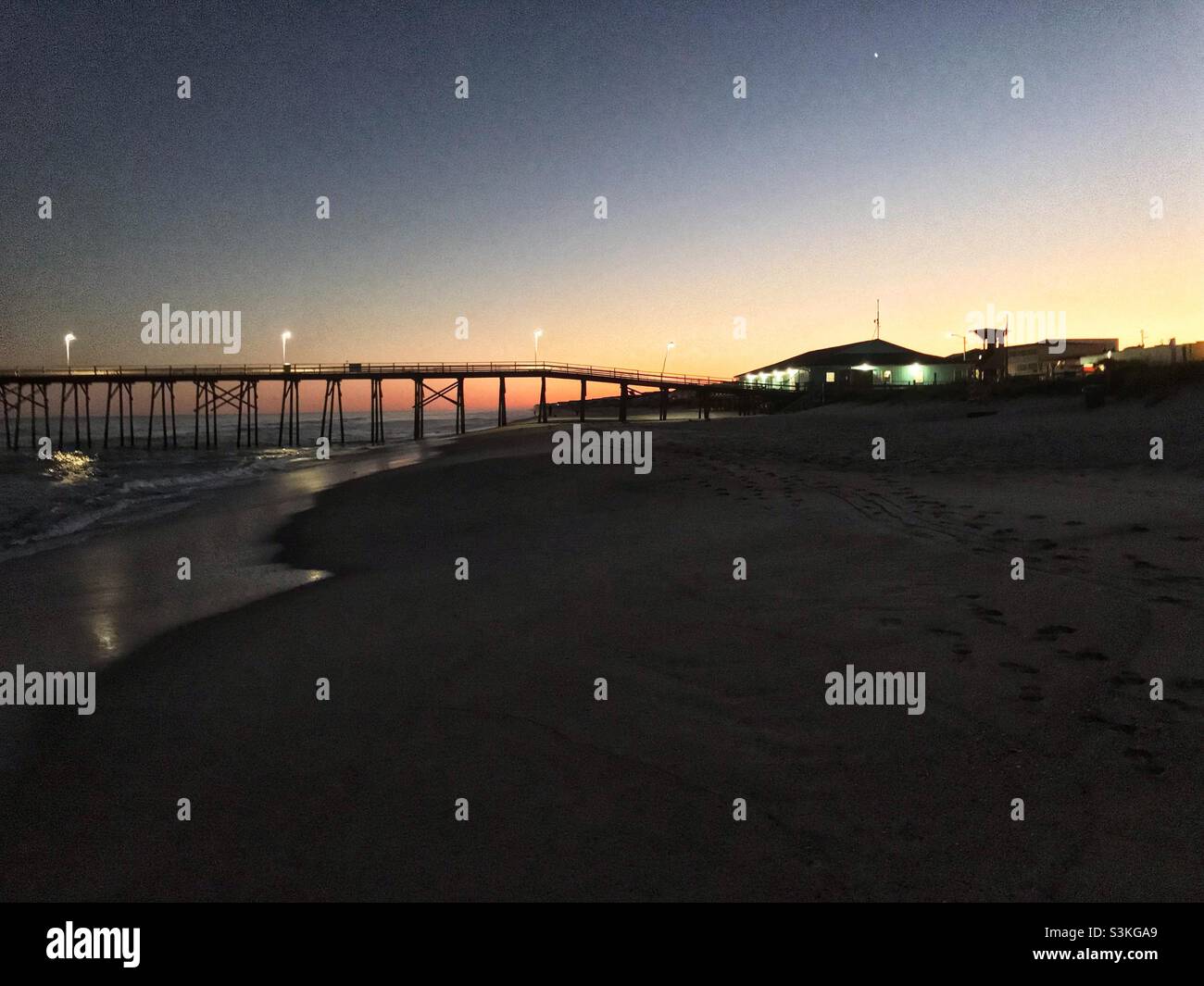 Sunset near fishing pier at Kure Beach, North Carolina in November - Smartphone Captured Stock Image