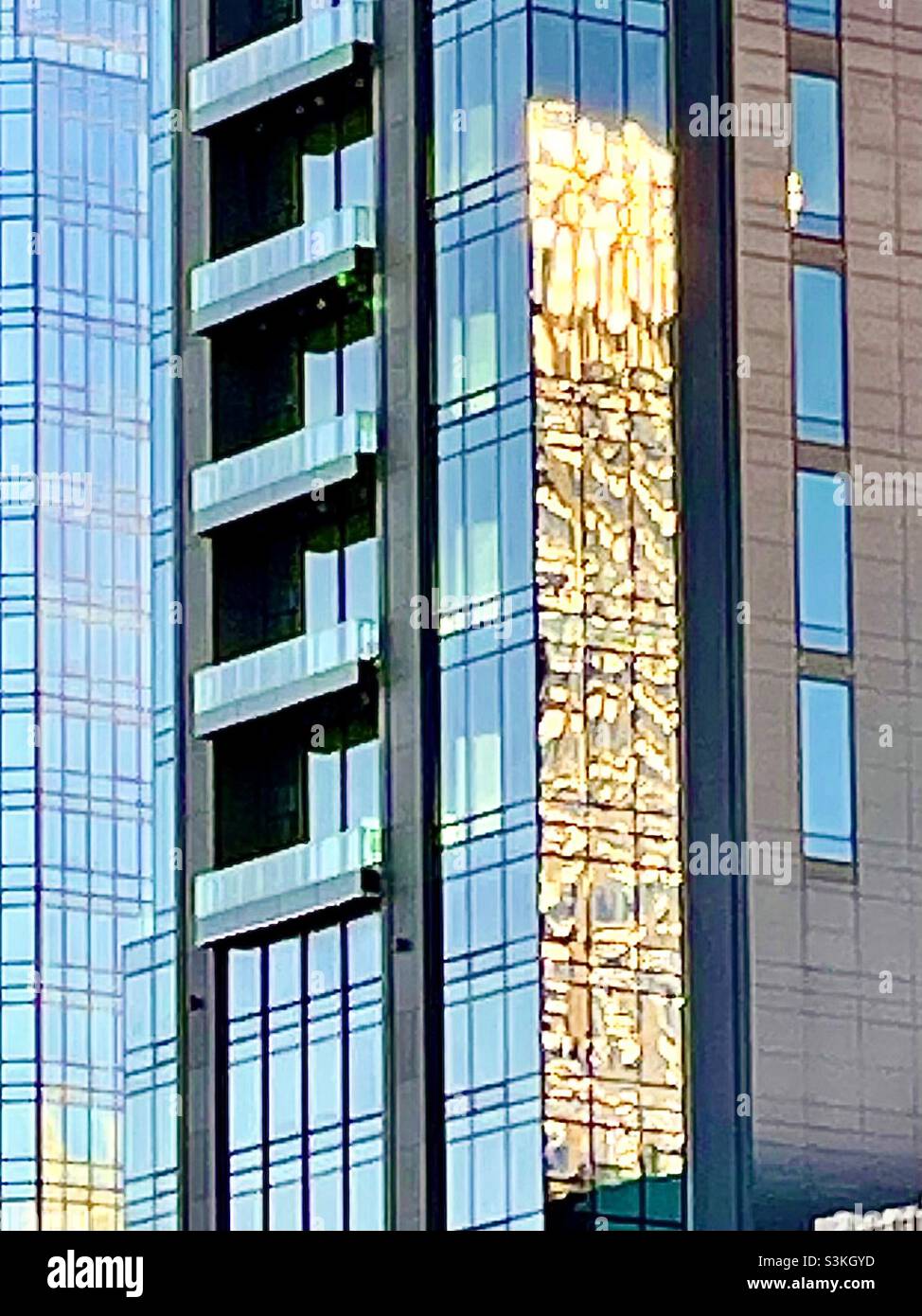 Sunlight reflection on the glass building in New York City - Smartphone Captured Stock Image