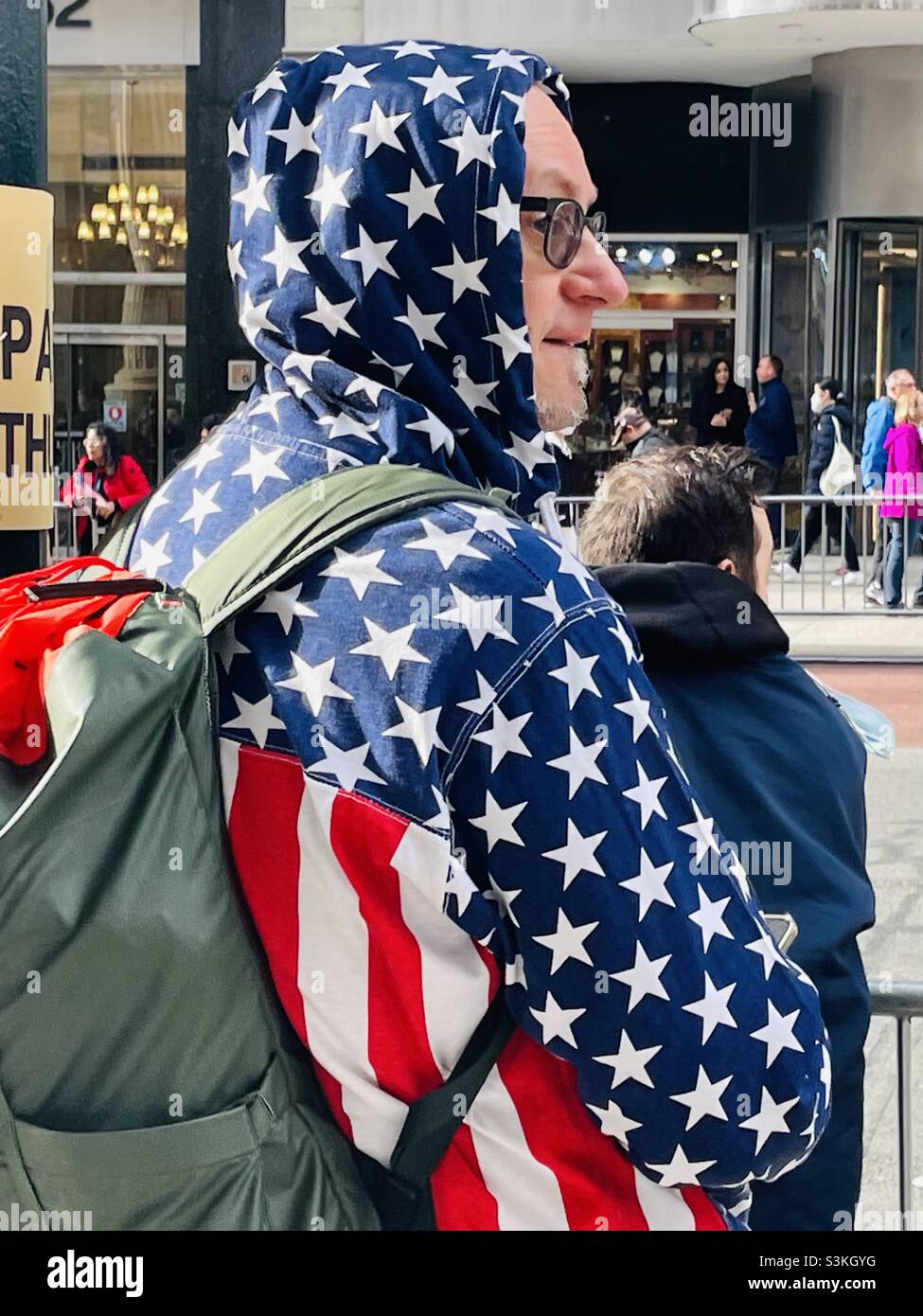 Patriotic spectator of the Veterans Day parade in New York - Smartphone Captured Stock Image