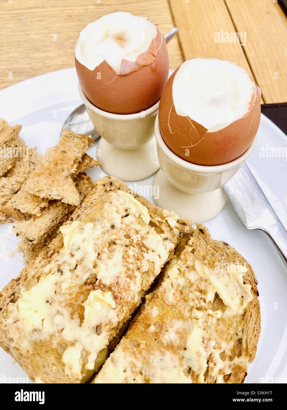 Breakfast boiled eggs with buttered toast Stock Photo Alamy
