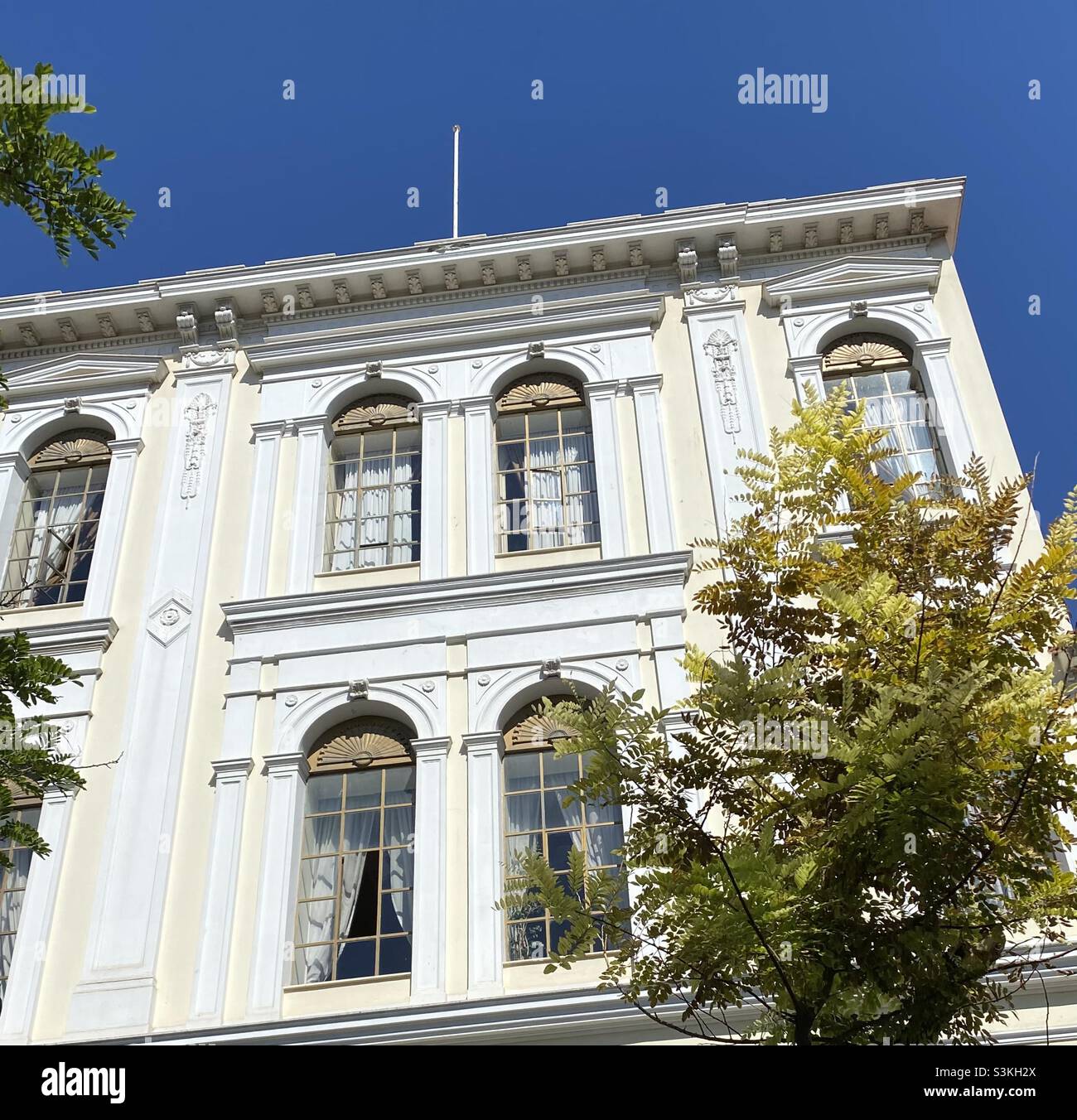 Restored, decorative and elegant neo-classical building in Mitropoleos Street, central Athens, Greece. Despite earlier city-centre demolitions, there are many such buildings awaiting restoration. Stock Photo