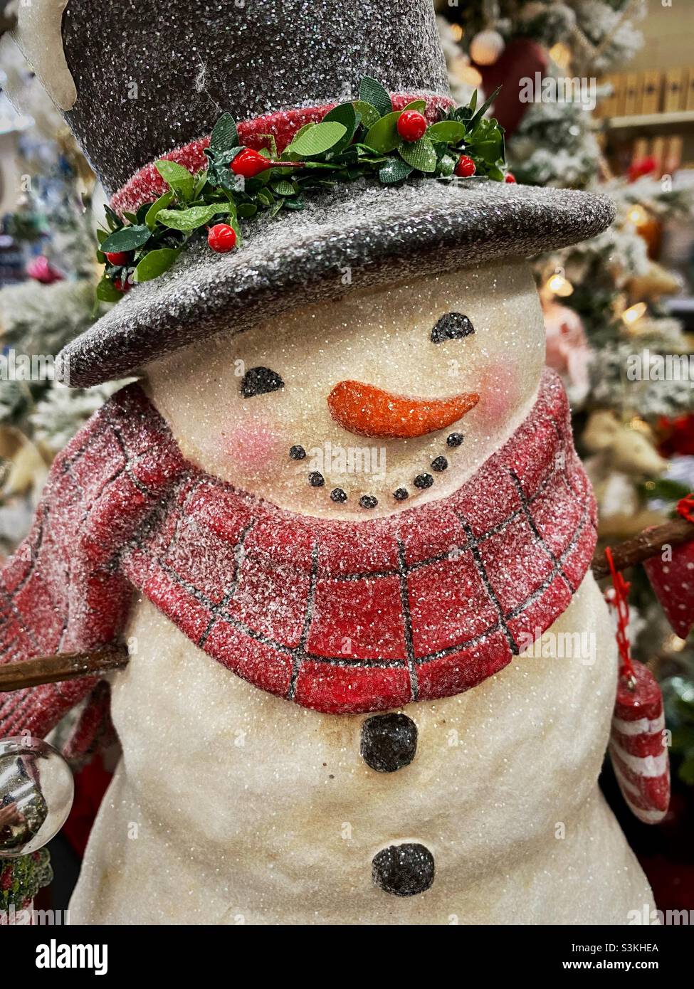 Smiling snowman with red scarf snd black hat - Smartphone Captured Stock Image