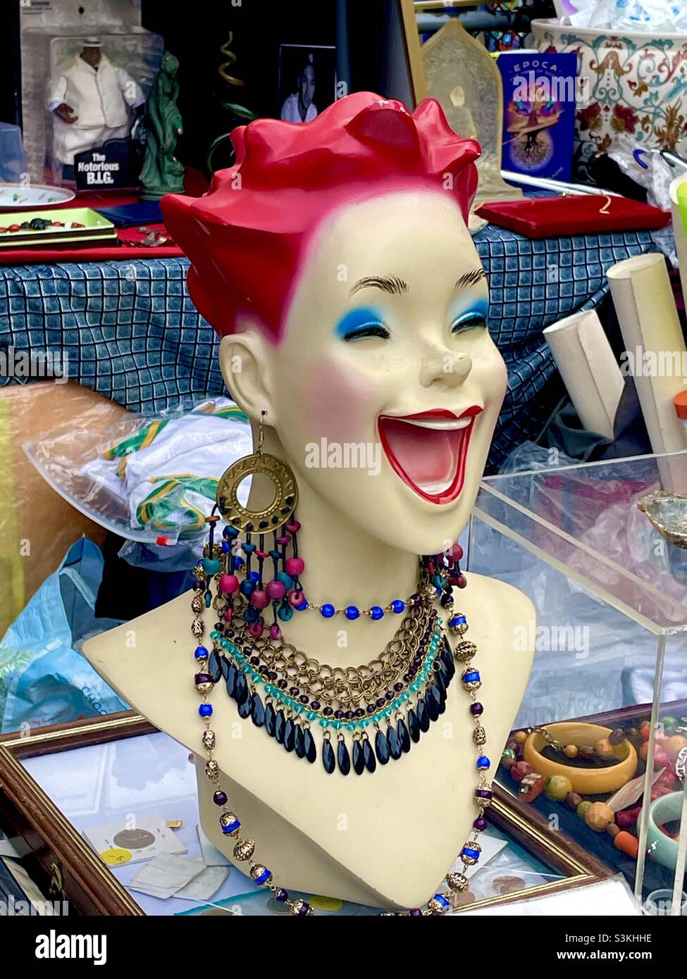 Brightly colored Laughing manikin head at a flea market Stock Photo Alamy