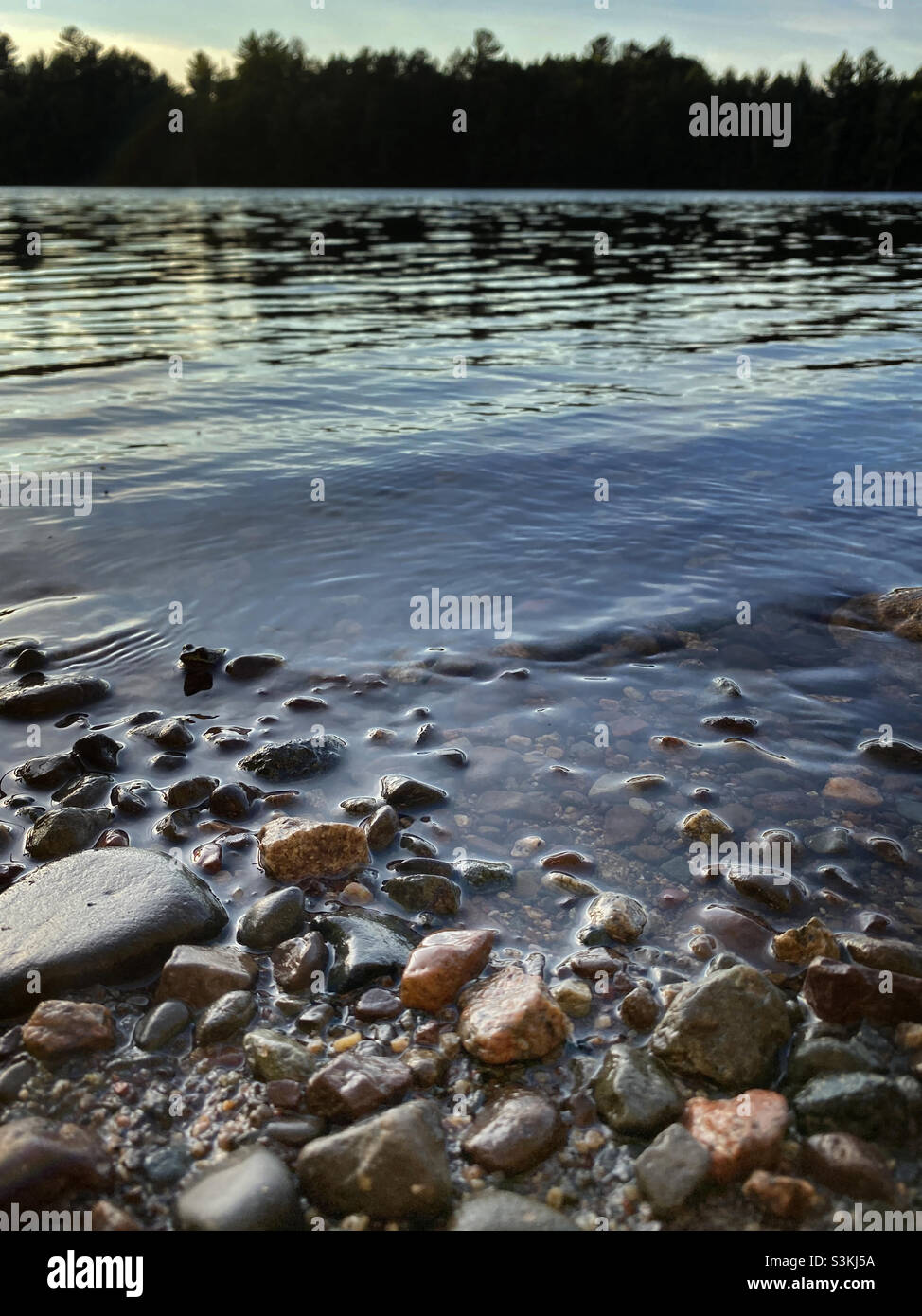 Rocky shoreline on lake in northern Wisconsin - Smartphone Captured Stock Image