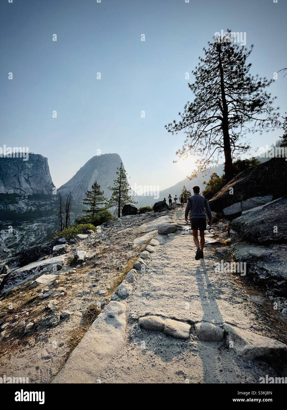 Early morning, hikers hike up the John Muir trail on the way to Half Dome. Yosemite National Park, California USA. - Smartphone Captured Stock Image