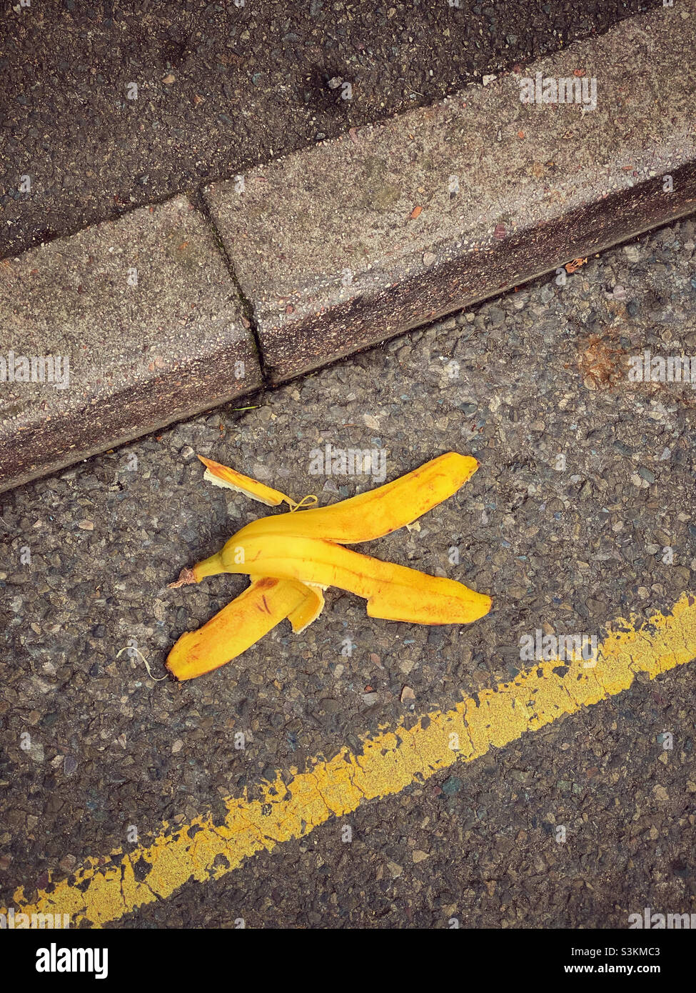 A discarded banana skin. Litter? Dangerous? Compostable? Photo ©️ COLIN HOSKINS. - Smartphone Captured Stock Image