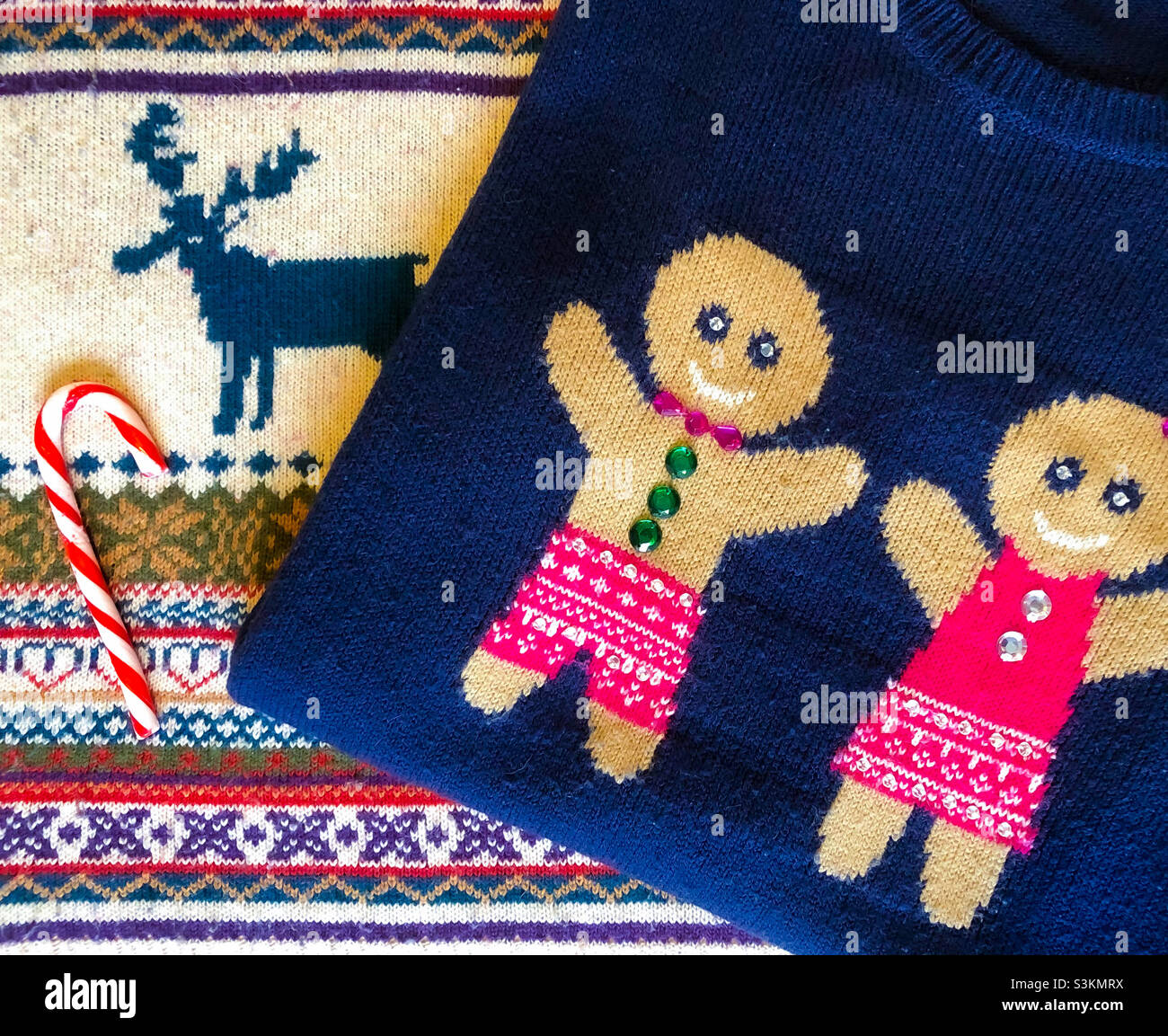 Christmas jumper flat lay with candy canes Stock Photo