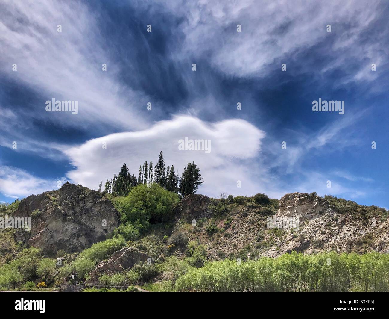 A dramatic sky behind a rugged landscape in Patagonia, Argentina. Stock Photo